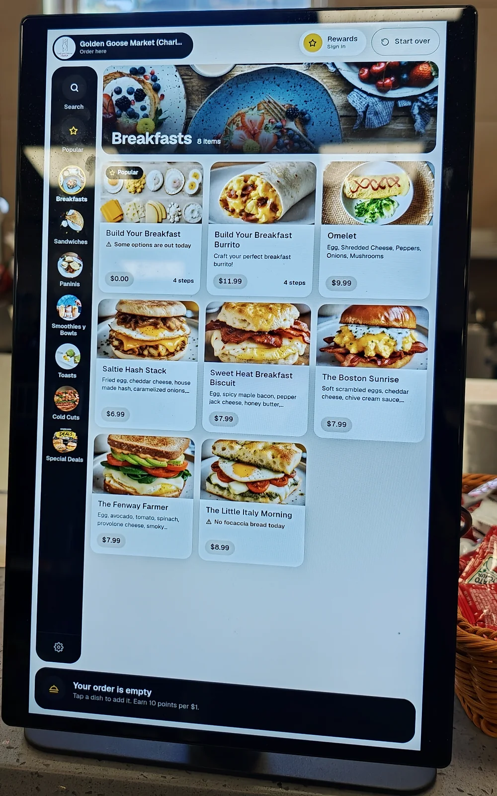 The Thimi kiosk menu on the counter at Golden Goose Market
