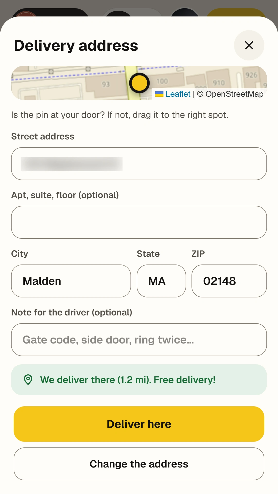 Delivery address form on a phone with map pin and a “We deliver there, free delivery” confirmation.