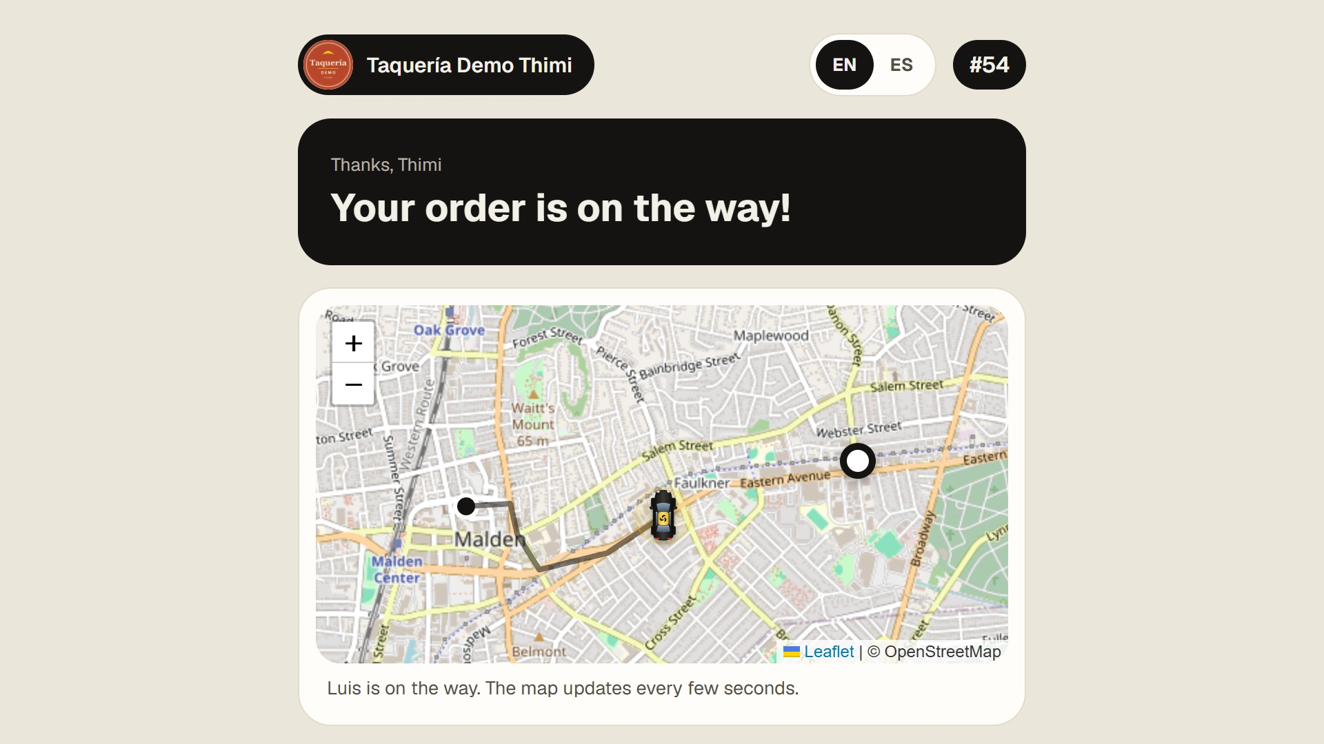 Order status page with a live map showing the delivery driver on the way.